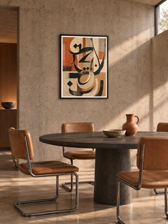 Terracotta Script: terracotta and charcoal abstract Arabic calligraphy, displayed in a slim black frame in a styled interior.