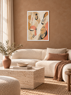 Sand Gesture: loose Arabic-inspired marks over sand and peach abstract shapes, displayed in a slim white frame in a styled interior.