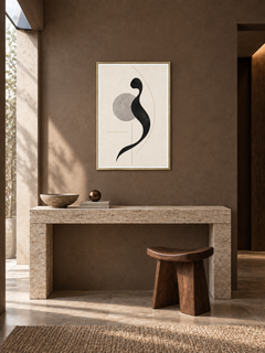 Quiet Mark: minimal black calligraphic form with a grey circle, displayed in a slim gold frame in a styled interior.