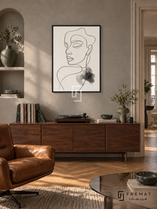 Contour by FREMAT: portrait line art in a black PVC frame with a printed white border, displayed in a styled interior.