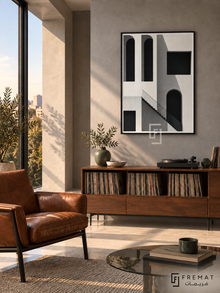 Shadow Facade by FREMAT: architectural arches and stairs in a black PVC frame with a printed white border, displayed in a styled interior.