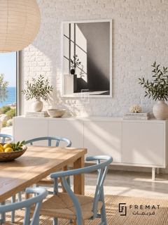 Window Light by FREMAT: window shadows and a vase in a white PVC frame with a printed white border, displayed in a styled interior.