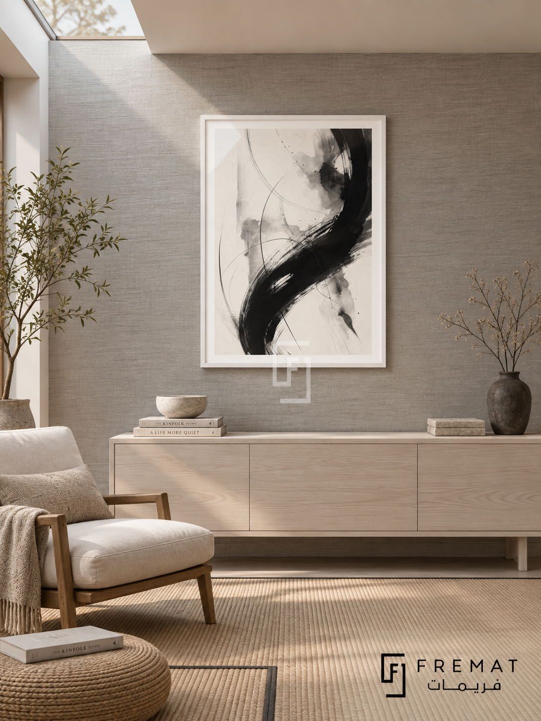 Ink Motion by FREMAT: expressive brushwork in a white PVC frame with a printed white border, displayed in a styled interior.