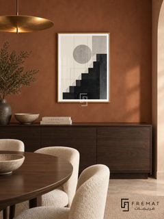 Graphic Steps by FREMAT: stepped geometric shapes in a gold PVC frame with a printed white border, displayed in a styled interior.