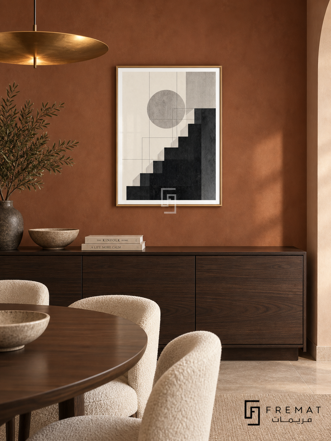 Graphic Steps by FREMAT: stepped geometric shapes in a gold PVC frame with a printed white border, displayed in a styled interior.