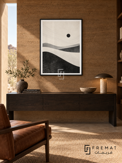 Desert Minimal by FREMAT: minimal desert dunes in a black PVC frame with a printed white border, displayed in a styled interior.
