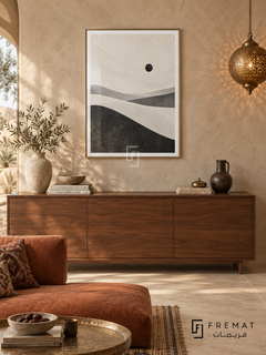 Desert Minimal by FREMAT: minimal desert dunes in a gold PVC frame with a printed white border, displayed in a styled interior.