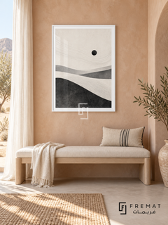 Desert Minimal by FREMAT: minimal desert dunes in a white PVC frame with a printed white border, displayed in a styled interior.
