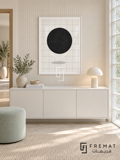 Sun Grid by FREMAT: a black sun and fine grid in a white PVC frame with a printed white border, displayed in a styled interior.