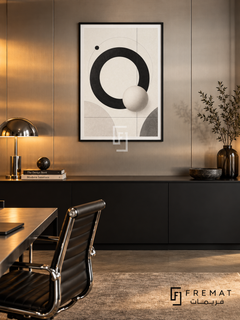 Orbit by FREMAT: orbital circles and a sphere in a black PVC frame with a printed white border, displayed in a styled interior.