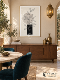 Linear Garden by FREMAT: botanical linework and geometry in a gold PVC frame with a printed white border, displayed in a styled interior.