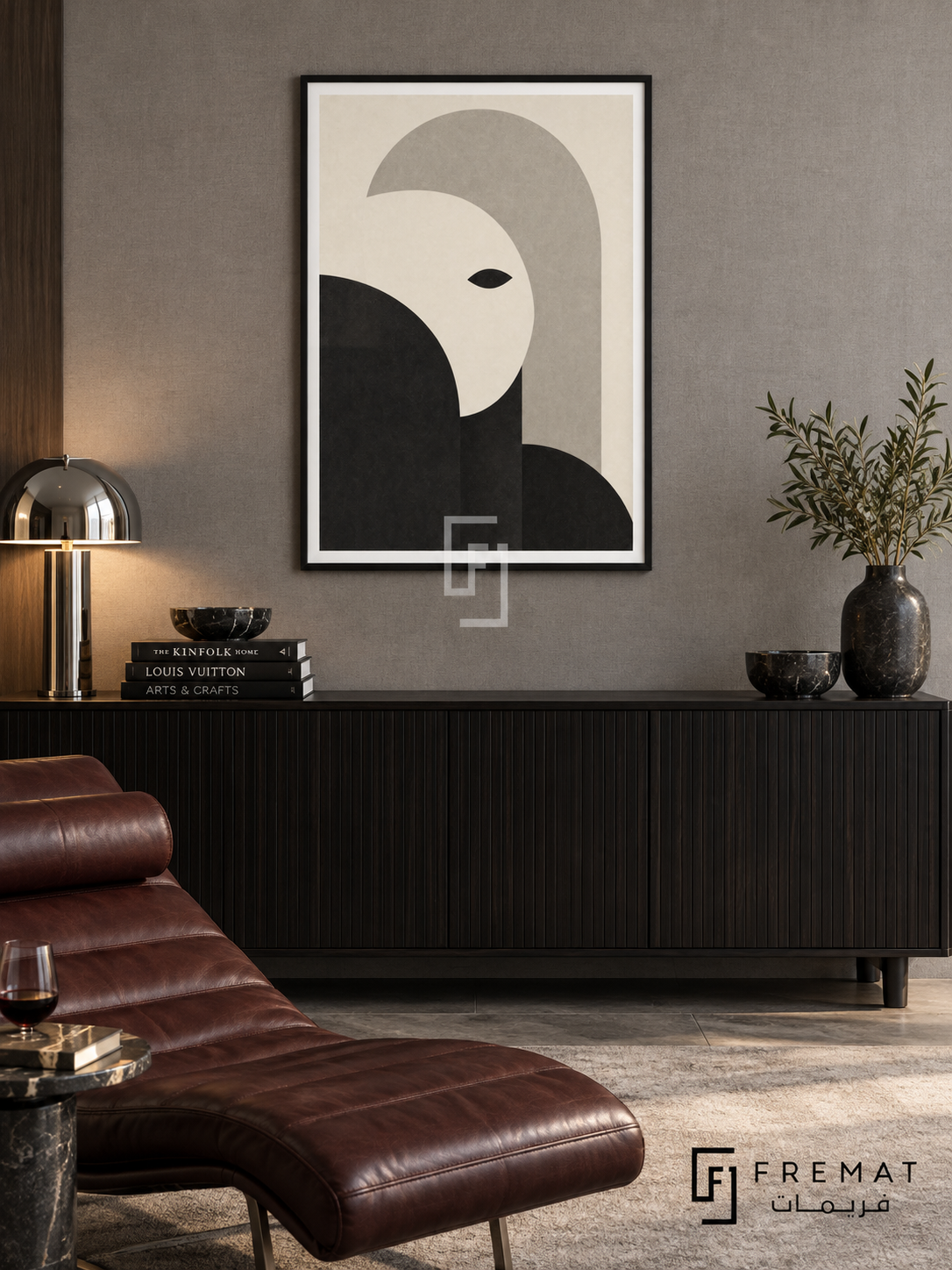 Monochrome Portrait by FREMAT: an abstract monochrome face in a black PVC frame with a printed white border, displayed in a styled interior.