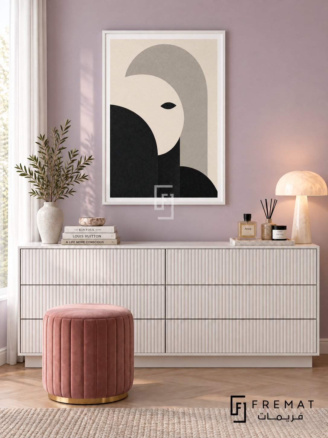 Monochrome Portrait by FREMAT: an abstract monochrome face in a white PVC frame with a printed white border, displayed in a styled interior.