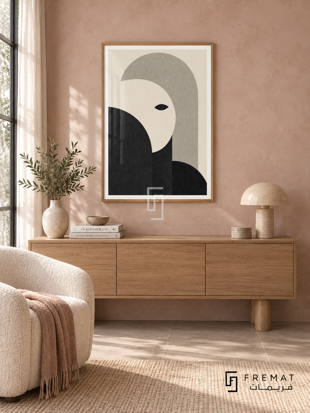Monochrome Portrait by FREMAT: an abstract monochrome face in a wooden texture PVC frame with a printed white border, displayed in a styled interior.