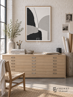 Paper Forms by FREMAT: a torn-paper style collage in a wooden texture PVC frame with a printed white border, displayed in a styled interior.