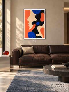 Coral Profile by FREMAT in a matte black PVC frame with a flat white printed border. Gallery lounge: beige microcement wall, 160cm dark chocolate leather settee, stainless cube side table left, slate-blue wool rug on pale stone floor, clear afternoon light, restrained red-orange glass ornament.