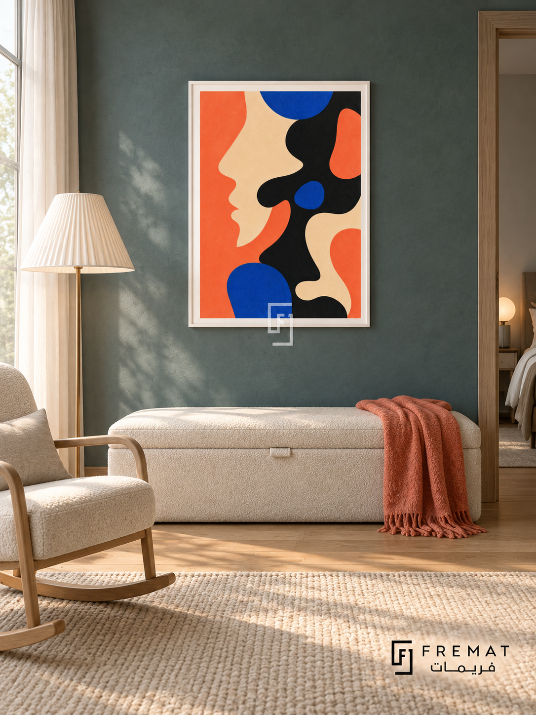 Coral Profile by FREMAT in a satin white PVC frame with a flat white printed border. Soft modern bedroom sitting area: smoky teal matte plaster wall, 150cm ivory upholstered storage bench below art, pale ash rocking chair left, white pleated floor lamp, warm pine boards, cloud-filtered side daylight and a folded coral throw.