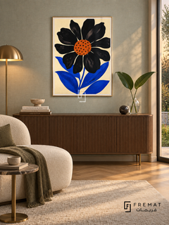 Graphic Flower by FREMAT in a champagne gold PVC frame with a flat white printed border. Refined garden salon: pale grey-green silk wallpaper, 155cm ribbed walnut console, cream curved chaise at left, brass-legged tiny side table, oak chevron floor, gentle dusk light and clear glass vase with two green leaves.