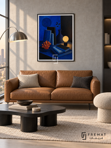 Night Table by FREMAT in a matte black PVC frame with a flat white printed border. Minimal city reading room: pale cool-grey concrete wall, 155cm caramel leather loveseat, asymmetrical black coffee table, mushroom pouf right, pale ash floor, silver arc lamp with soft late-day window light.