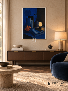 Night Table by FREMAT in a champagne gold PVC frame with a flat white printed border. Hotel-inspired private den: pale warm limestone wall, 150cm walnut console with leather-front drawers, blue velvet club chair right, travertine disk table left, dark parquet, low warm shaded lamps and fine curtain-filtered daylight.