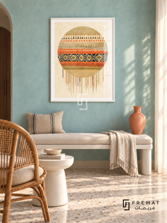 Textile Sun by FREMAT in a satin white PVC frame with a flat white printed border. Fresh craft-inspired room: pale turquoise limewash wall, 145cm satin-white bench with linen cushion, natural rattan chair left, white small pedestal table, terrazzo floor, soft sunny curtain light and a coral vase.