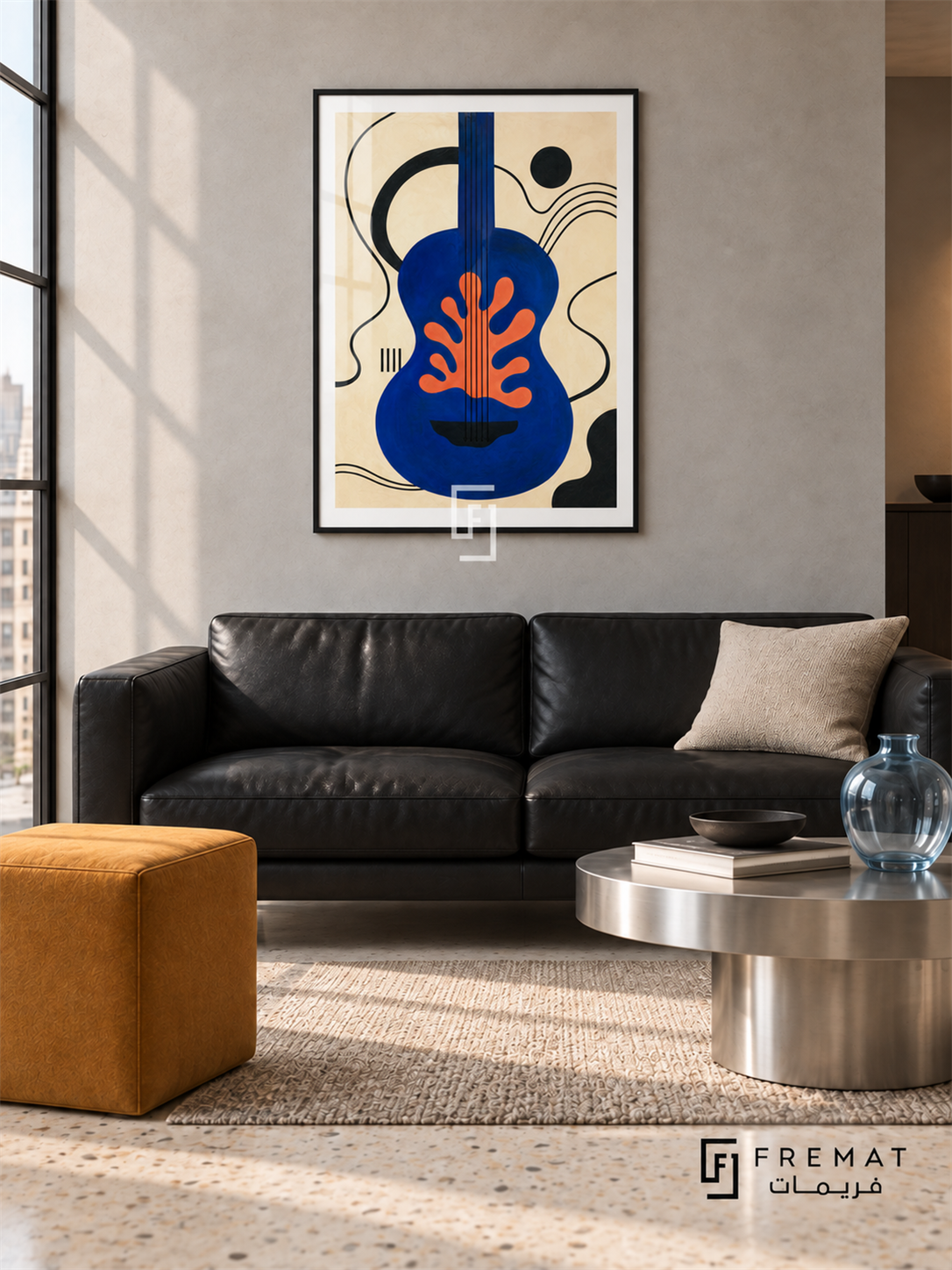 Blue Guitar by FREMAT in a matte black PVC frame with a flat white printed border. Contemporary music loft: pale grey microcement wall, 160cm black leather two-seat sofa, brushed steel low table right, ochre cube stool left, cream terrazzo floor, soft skylight and pale blue glass vessel.