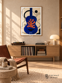 Blue Guitar by FREMAT in a light natural wood PVC frame with a flat white printed border. Warm record-listening nook: light oatmeal plaster wall, 150cm pale oak record cabinet, russet sling chair left, stone round side table, cream rug and ash boards, diagonal morning light and small cream ceramic lamp.