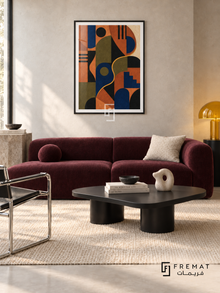 Colour Rhythm by FREMAT in a matte black PVC frame with a flat white printed border. Modern design lounge: pale neutral concrete wall, 160cm aubergine wool sofa, black powder-coated asymmetric coffee table, chrome chair left, cream flatweave rug, soft north light and sculptural yellow glass lamp.