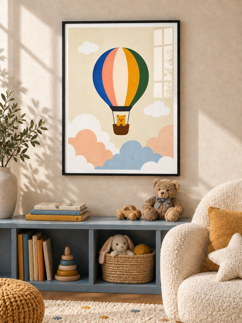 Balloon Day kids wall art in a black PVC frame, with a bear in a colourful hot air balloon above pastel clouds.