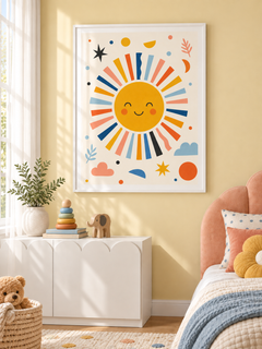 Sunny Face smiling sun print with colourful rays in a white PVC frame, styled in a child's room.