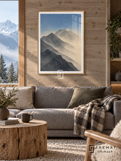 Mountain Mist NAT04 by FREMAT in a slim light wood-grain PVC frame, with an even white printed border, subtle glazing reflections and furniture showing scale.