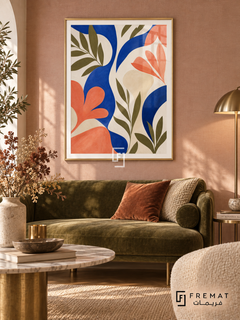 Abstract Garden NAT06 by FREMAT in a slim champagne gold PVC frame, with an even white printed border, subtle glazing reflections and furniture showing scale.