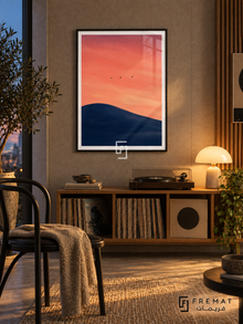 Birds at Dusk NAT07 by FREMAT in a slim matte black PVC frame, with an even white printed border, subtle glazing reflections and furniture showing scale.