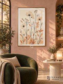 Wildflower NAT09 by FREMAT in a slim champagne gold PVC frame, with an even white printed border, subtle glazing reflections and furniture showing scale.