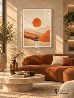 Desert Horizon NAT11 by FREMAT in a slim champagne gold PVC frame, with an even white printed border, subtle glazing reflections and furniture showing scale.