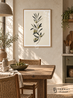 Olive Branch NAT12 by FREMAT in a slim light wood-grain PVC frame, with an even white printed border, subtle glazing reflections and furniture showing scale.