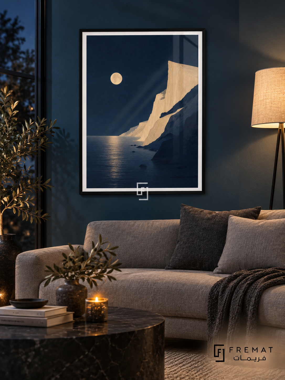 Moonlit Coast NAT13 by FREMAT in a slim matte black PVC frame, with an even white printed border, subtle glazing reflections and furniture showing scale.