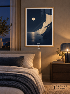 Moonlit Coast NAT13 by FREMAT in a slim light wood-grain PVC frame, with an even white printed border, subtle glazing reflections and furniture showing scale.