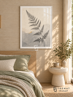 Fern Silhouette NAT16 by FREMAT in a slim satin white PVC frame, with an even white printed border, subtle glazing reflections and furniture showing scale.