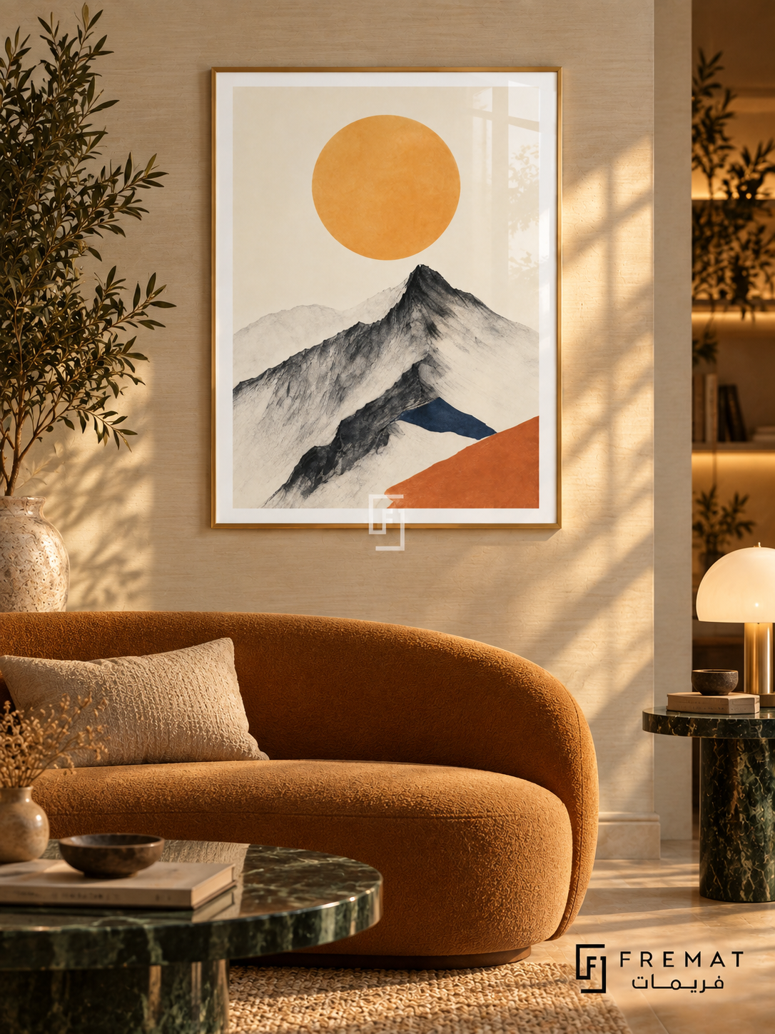 Mountain Sun NAT19 by FREMAT in a slim champagne gold PVC frame, with an even white printed border, subtle glazing reflections and furniture showing scale.