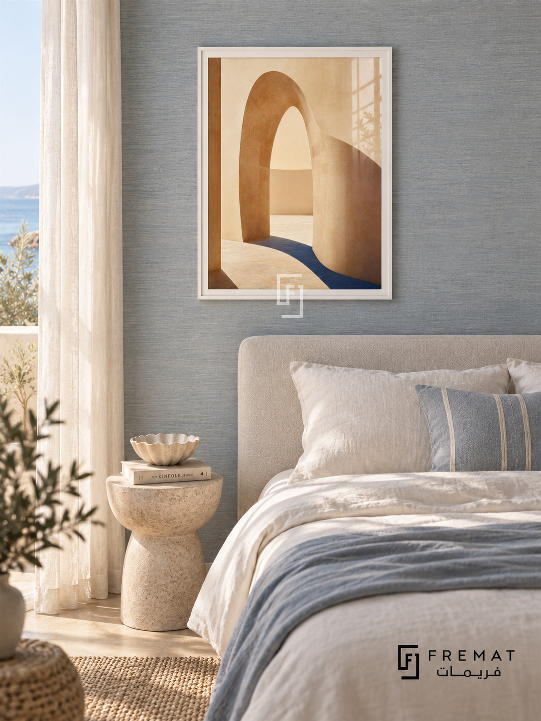Quiet Arch (PLC01) framed architectural wall art with a satin white PVC frame, flat white paper border and glass reflection. Soft coastal bedroom, pale dusty-blue grasscloth, linen upholstered double bed 160cm.