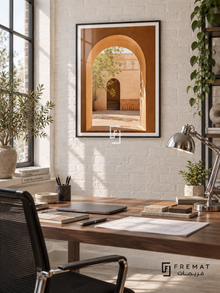 Courtyard Window (PLC03) framed architectural wall art with a matte black PVC frame, flat white paper border and glass reflection. Architect home office, white-painted brick, walnut writing table 140cm.
