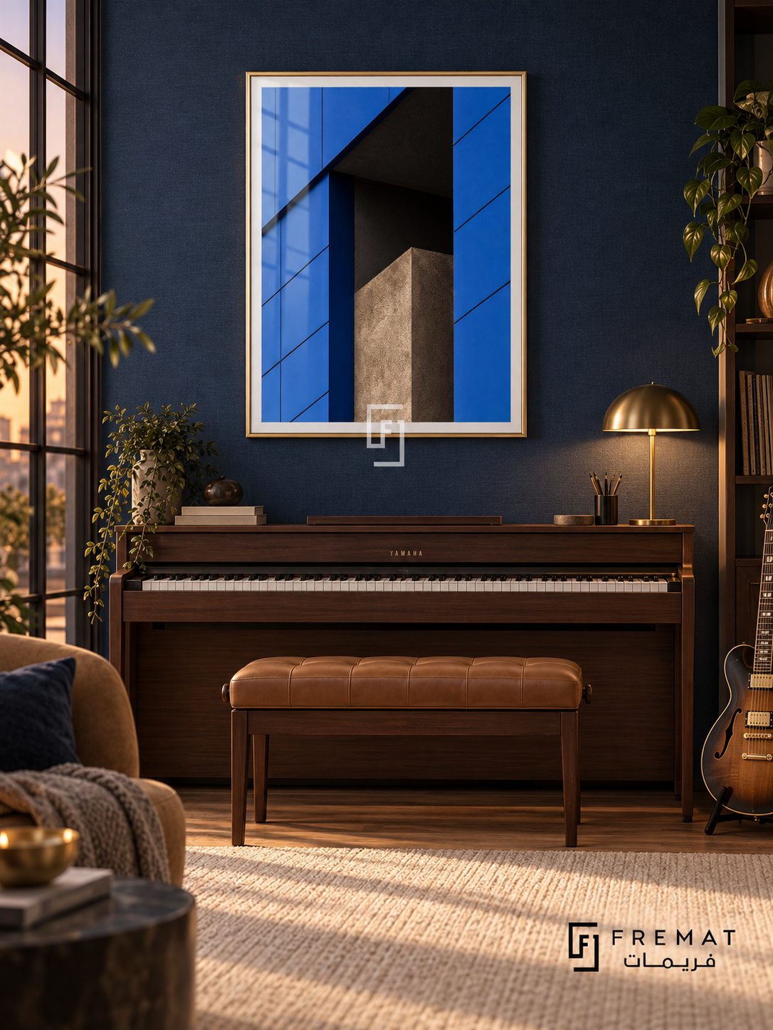 Blue Facade (PLC04) framed architectural wall art with a champagne gold PVC frame, flat white paper border and glass reflection. Elegant music room, navy wall fabric, walnut electric piano 140cm below frame.