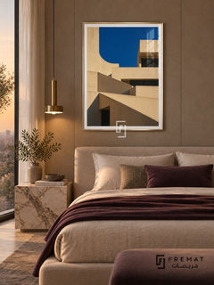 Terrace Forms (PLC09) framed architectural wall art with a champagne gold PVC frame, flat white paper border and glass reflection. Contemporary suite, taupe suede wall panels, low platform bed 170cm.