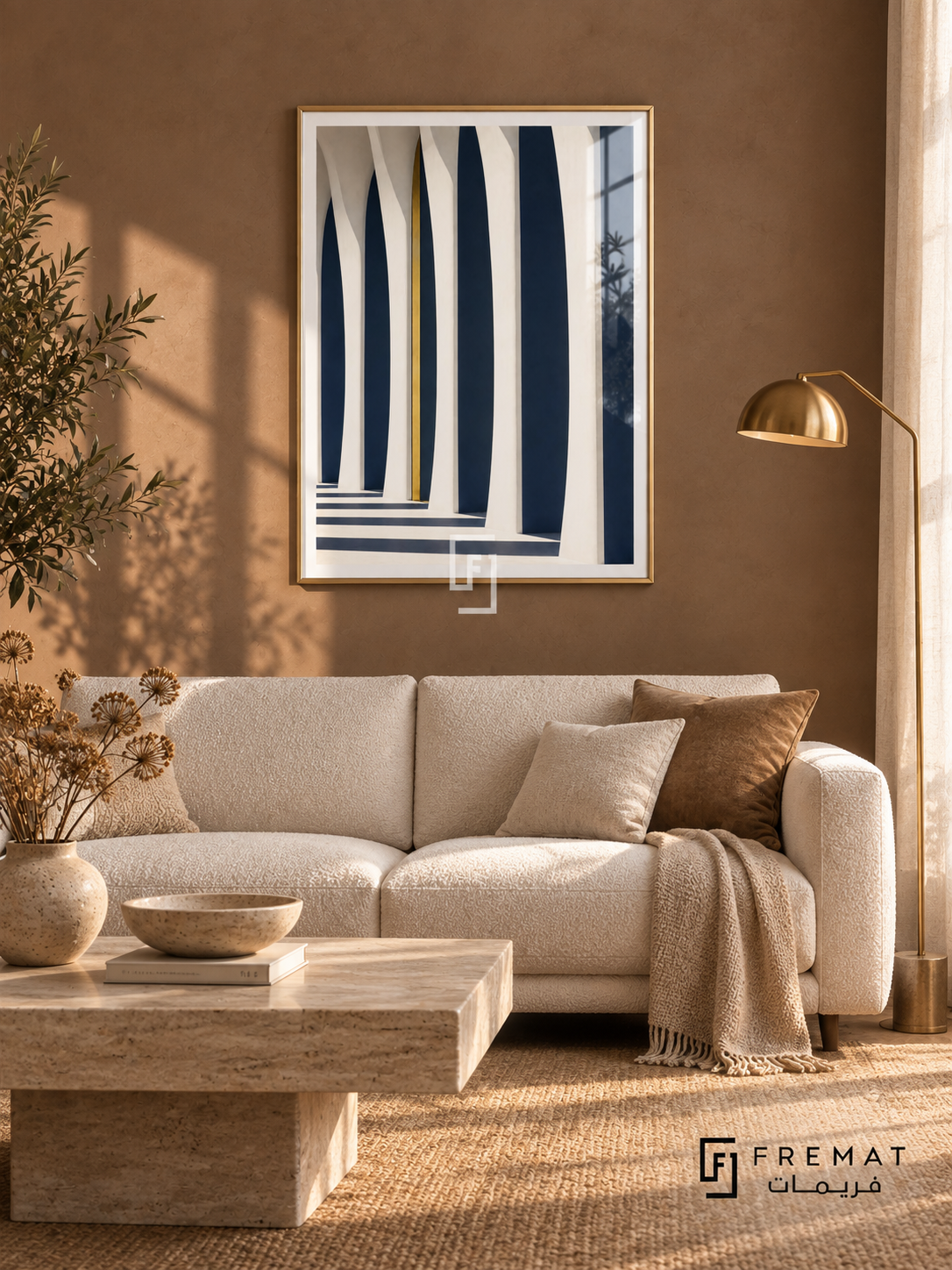 Column Light (PLC11) framed architectural wall art with a champagne gold PVC frame, flat white paper border and glass reflection. Elegant salon, cocoa plaster wall, ivory two-seat sofa 175cm.