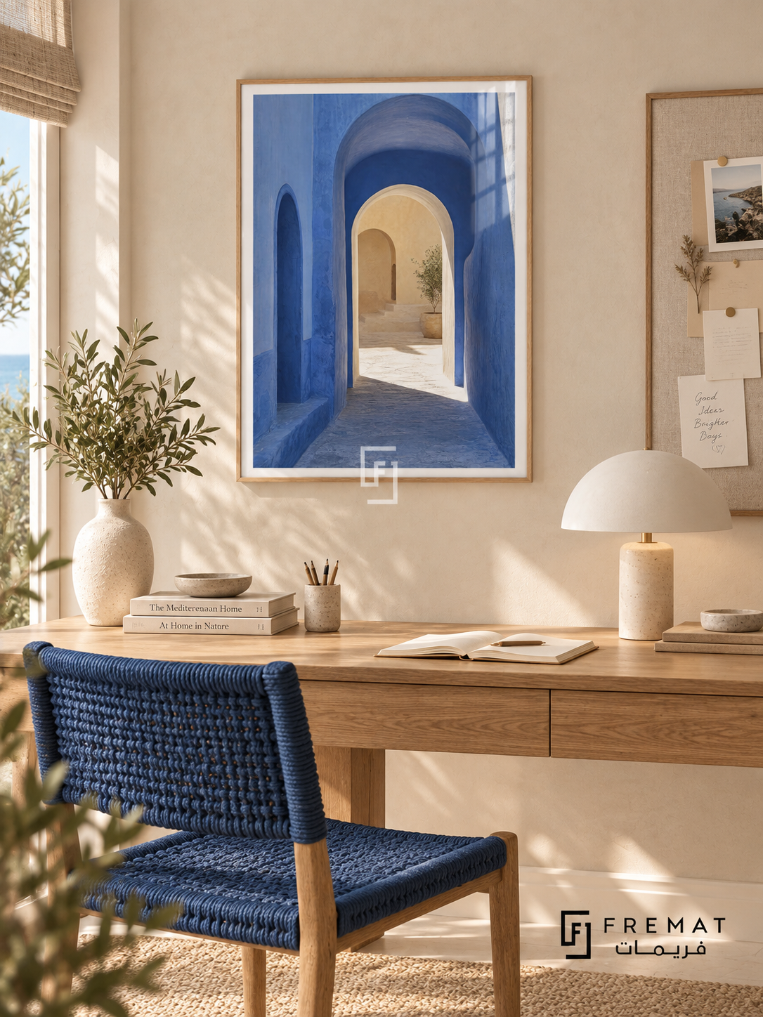 Passage Blue (PLC12) framed architectural wall art with a light wood-grain PVC frame, flat white paper border and glass reflection. Coastal workroom, warm chalk wall, oak desk 145cm.