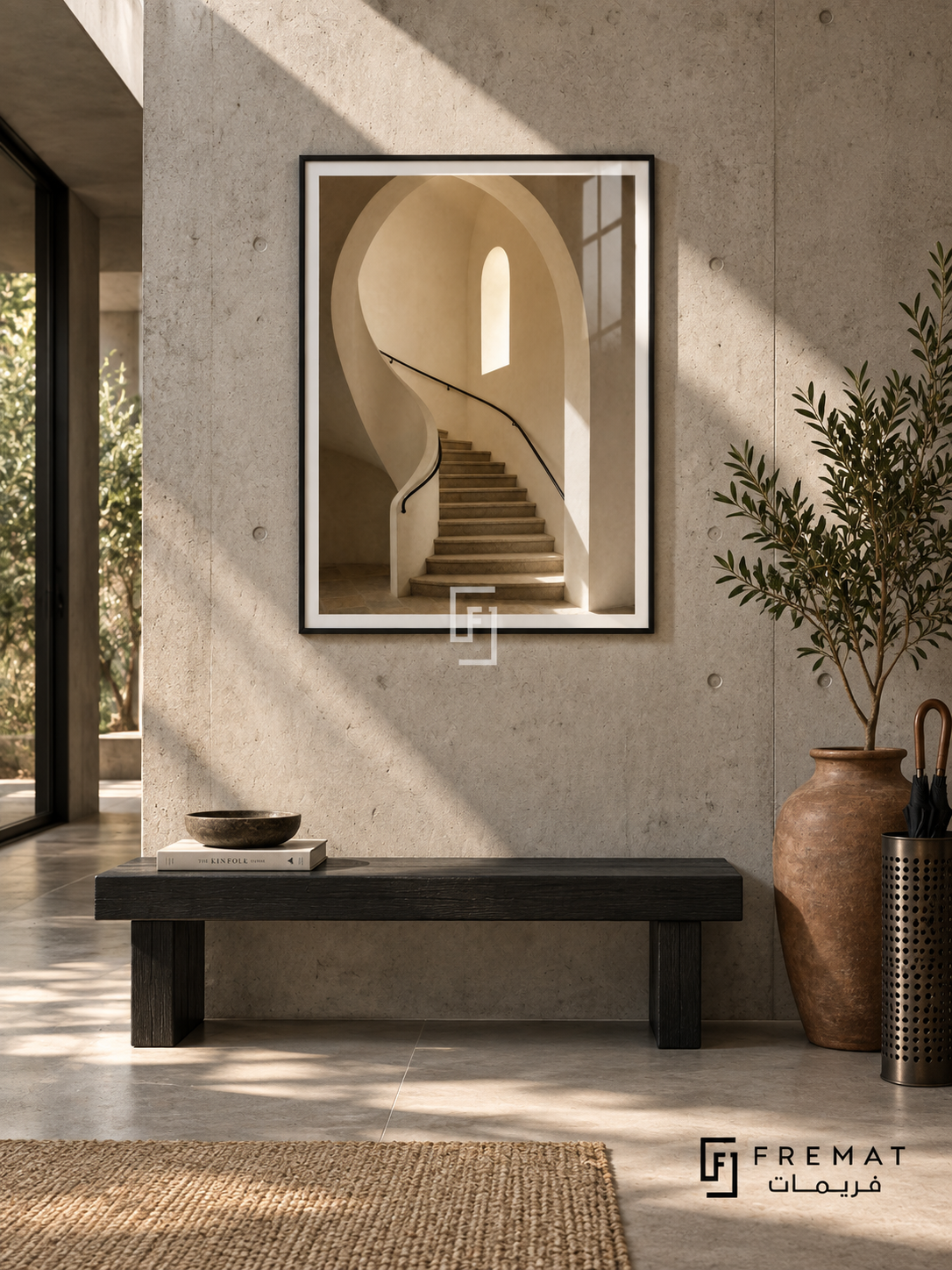 Stone Stairwell (PLC14) framed architectural wall art with a matte black PVC frame, flat white paper border and glass reflection. Brutalist foyer, pale raw-concrete wall, black oak bench 155cm.