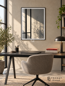 Window Shadows (PLC15) framed architectural wall art with a matte black PVC frame, flat white paper border and glass reflection. Modern creative office, sand microcement wall, black desk 150cm.