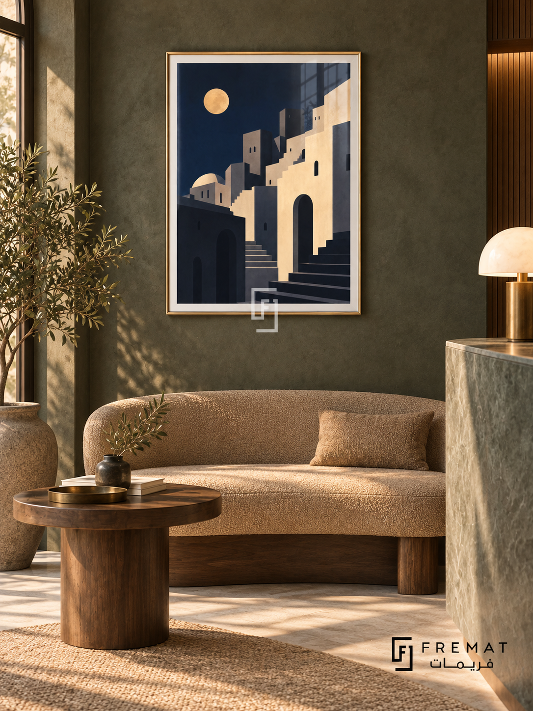 City Moon (PLC19) framed architectural wall art with a champagne gold PVC frame, flat white paper border and glass reflection. Boutique reception nook, charcoal-green limewash, tan curved bench 160cm.