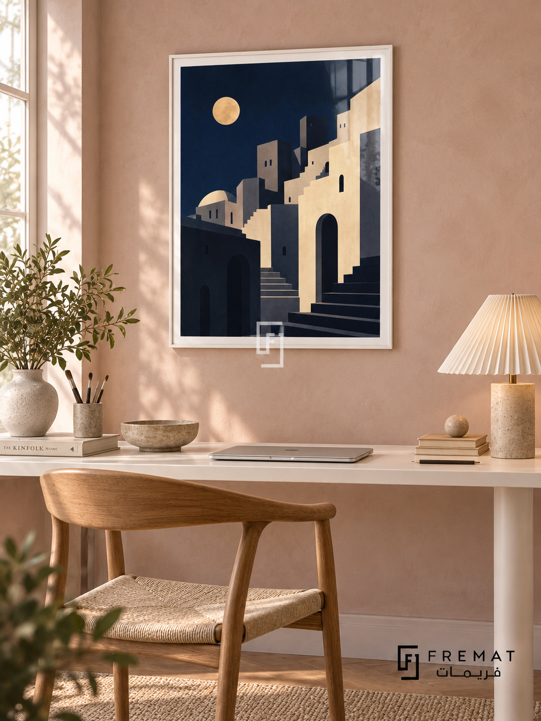 City Moon (PLC19) framed architectural wall art with a satin white PVC frame, flat white paper border and glass reflection. Calm creative corner, light clay-pink plaster, white desk 145cm.